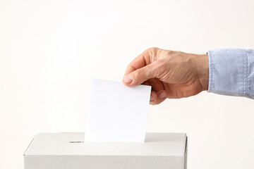 Voting man near ballot box