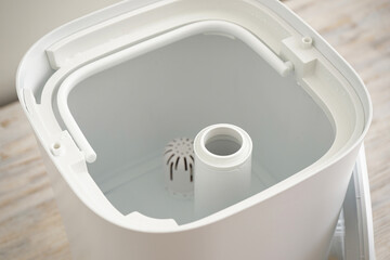 Water tank in a modern humidifier, close-up.