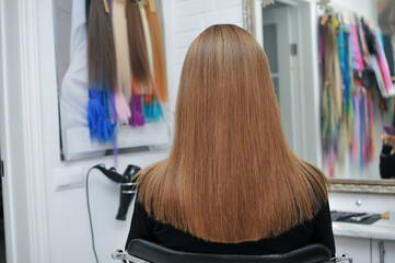 Long brown hair on woman in beauty salon