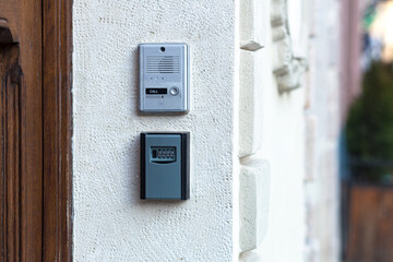 doorbell with remote door opening near the vintage door, in the old part of town
