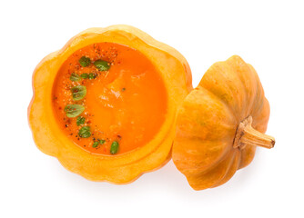 Delicious cream soup served in pumpkin on white background