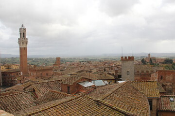 Panorama dal Facciatone, panoramic view of Siena, Italy of  church facade, and centuries-old towers & piazzas.