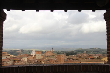 Panorama dal Facciatone, panoramic view of Siena, Italy of  church facade, and centuries-old towers & piazzas.