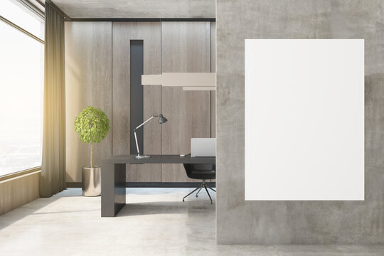 Modern concrete and wooden office interior with empty white mock up frame, window and city view, desktop, computer and decorative green plant in pot. Workspace and nobody concept. 3D Rendering.