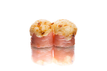 Side view of Two Japanese Baked sushi roll with melted cheese on top. Traditional Asian seafood dish
