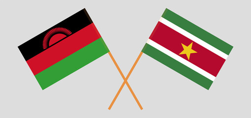 Crossed flags of Malawi and Suriname. Official colors. Correct proportion