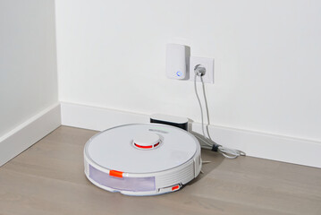 robot vacuum cleaner on charging dock station. close up
