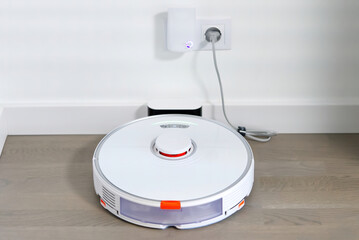 robot vacuum cleaner on charging dock station. close up