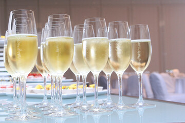 Glasses with champagne on the table. High reception. Buffet at a secular party.Lots of wine glasses. Holidays concept.