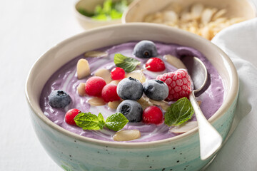 Creamy cold soup with frozen berries and mint.