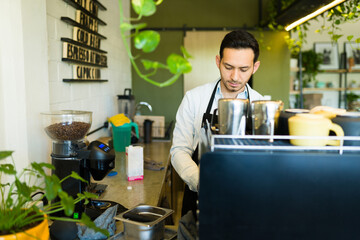Fototapeta premium Handsome young barista working