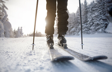 Skiing. Ski on First Tracks. Alpine skier going downhill skiing in morning on Fresh Tracks on...