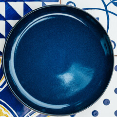 Plate on tile background