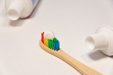 Toothpaste and toothbrush on white.