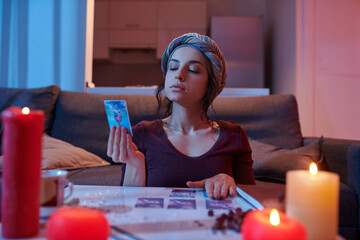Dark-haired Caucasian soothsayer focused on her divination
