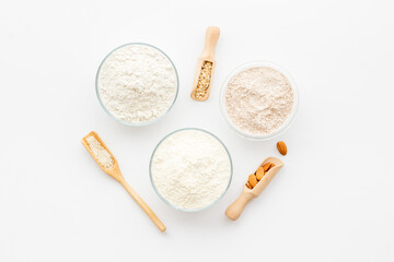 Various types of gluten free flour - almond peanut oat rice flour in bowls