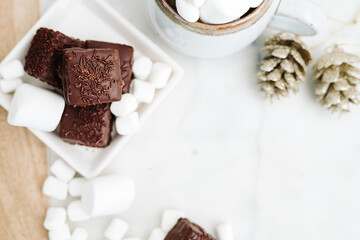 Dark Chocolate Petit Four Cakes with Marshmallows and Hot Chocolate Flat Lay