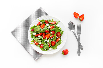 Healthy spinach salad with strawberry. Vegetarian lunch