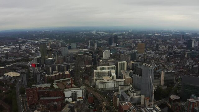 Aerial view of Manchester city in UK on a beautiful cloudy day.