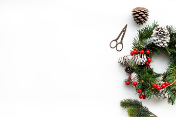 Christmas wreath with with fir tree, ribbon and decor. New year decoration