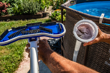 cleaning the pool with a vacuum cleaner. dirty filter after cleaning water. Cleaning equipment for...