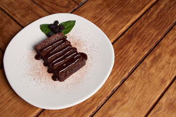 Brownie with raisins on withe dish