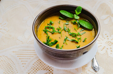 Pumpkin Puree Garnished With Celery And Mint