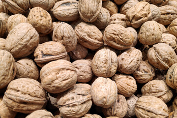 Stack of walnuts on a market stall