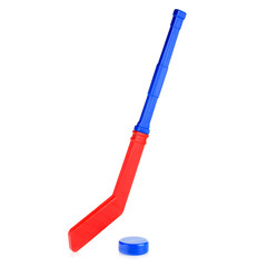Children's hockey stick and puck for playing hockey. Blue and red hockey stick isolated on a white background