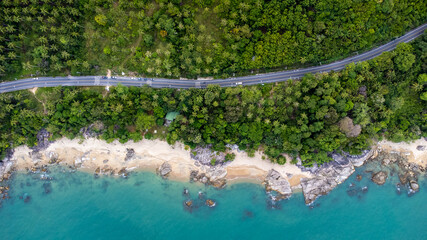 Ocean Road and sand beach in Khanom Sichon Road at Khao Phlai Dam ,Nakorn Sri Thammarat province, Thailand. Shot by Drone Aerial View