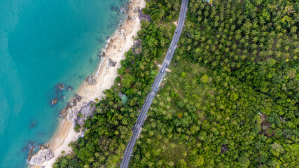 Ocean Road and sand beach in Khanom Sichon Road at Khao Phlai Dam ,Nakorn Sri Thammarat province, Thailand. Shot by Drone Aerial View