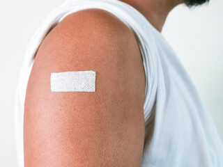 Close up vaccination of a man arm. Injection and clinical trials.