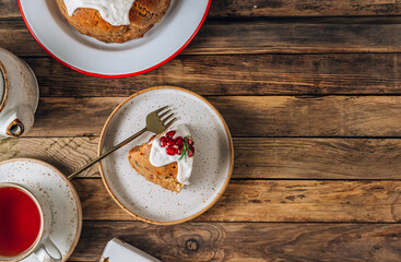 Traditional Christmas fruit pudding on festive background.