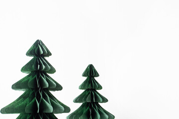 Trendy decorative Christmas trees, which made of paper with blurred house background, DIY project, Organic Modern Design, Hanging Festive Honeycomb Foldable 3D tree