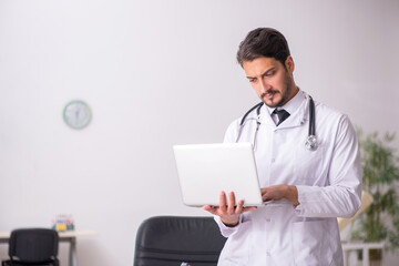 Young male doctor in telemedicine concept