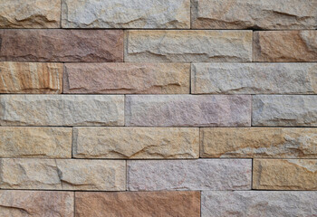 Close-up of modern brick block wall textured pattern for text backgrounds.