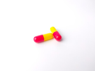 Piles of pills and capsule on white background,isolated.Selective focus.