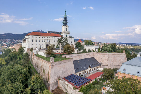 Aerial view of Nitra castle in Slovakia with bastions and sentry towers, bishop palace and baroque church tower above the city