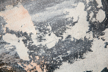 surface covered with decorative plaster with a chaotic pattern, multi-colored spots