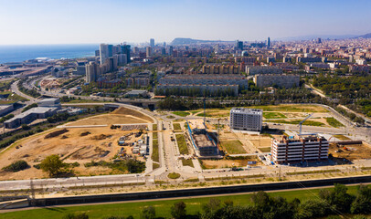 Fototapeta premium View from drone of Diagonal Mar district on sunny fall day, Barcelona, Spain