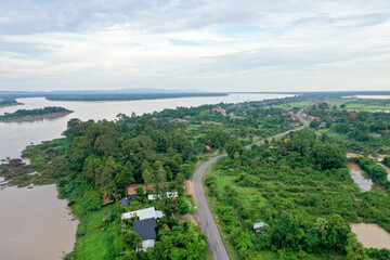 Scenic aerial view flying over the land field.