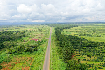 Scenic aerial view flying over the land field.