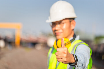 Engineer man showing thumb up, Cheerful factory worker smiling with giving thumbs up as sign of success