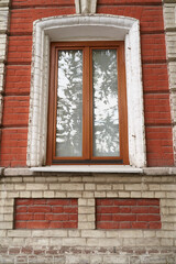 Fototapeta premium Old brick wall, old texture of red stone blocks closeup 
