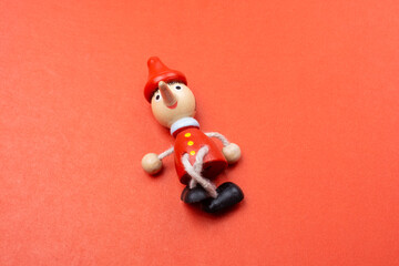 Old Pinocchio wooden doll of fairy tale character