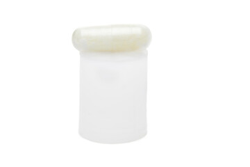 Herbal capsule on the podium, food supplement, vitamin pill, herbal medicine on a white background