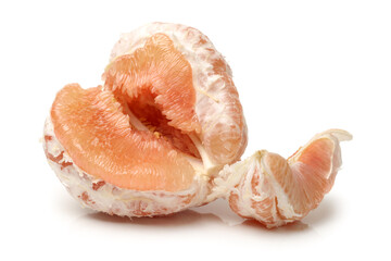 peeled pomelo pieces isolated on white background. Tasty fresh fruit eating concept.