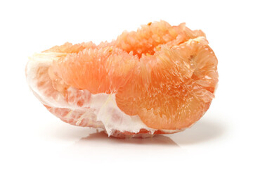 peeled pomelo pieces isolated on white background. Tasty fresh fruit eating concept.