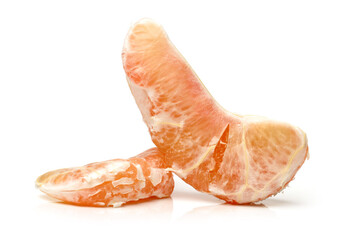 peeled pomelo pieces isolated on white background. Tasty fresh fruit eating concept.