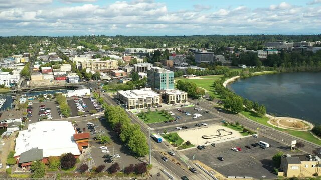 Cinematic 4K aerial drone pan shot of the Olympia Yacht Club near the Washington State Capitol Building and Campus, Capitol Lake with panoramic view of the historic district in Olympia, Washington